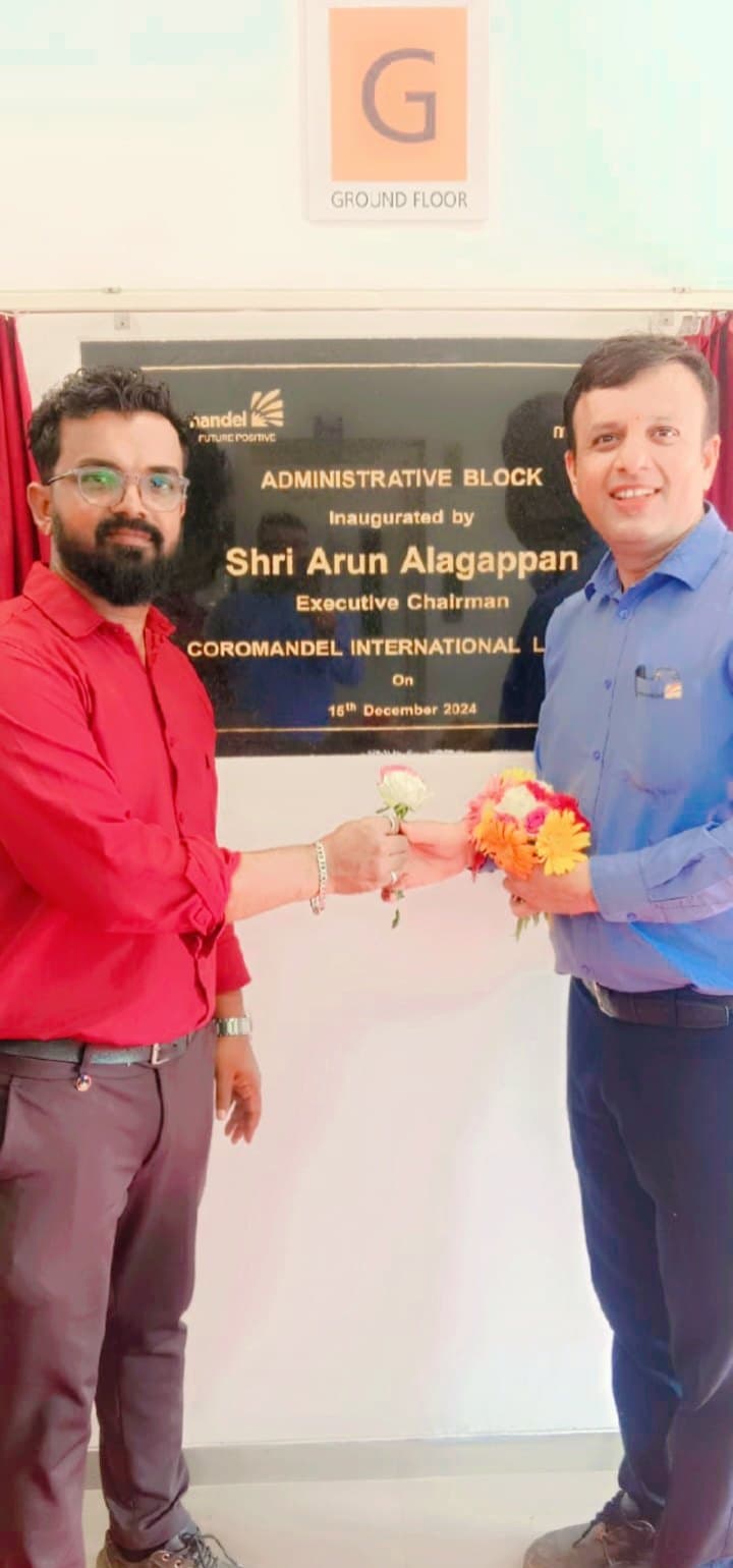 Flower exchange in front of the Coromandel International administrative block inauguration plaque