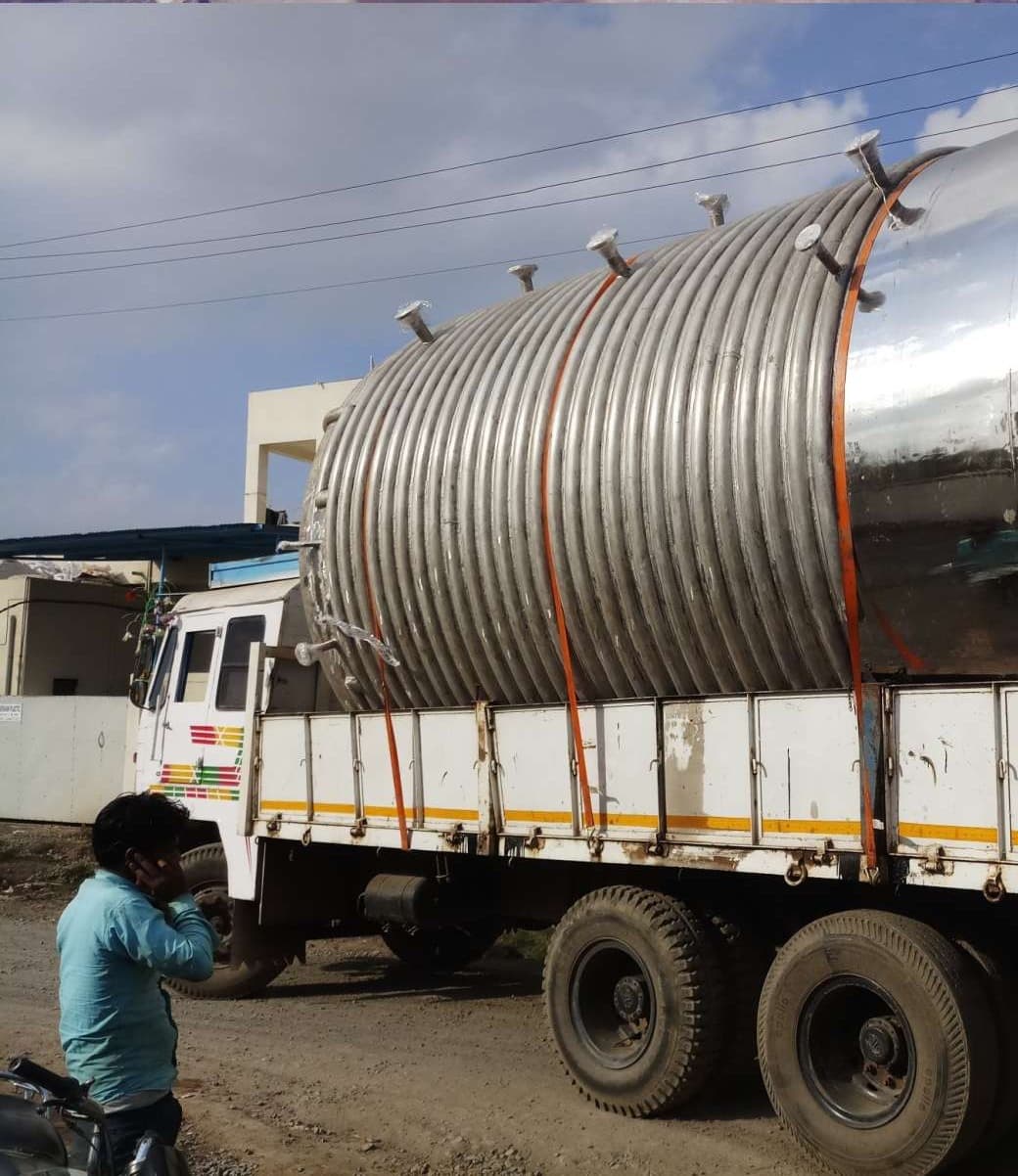 Jacketed process vessel secured on a trailer for transport